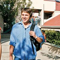 A commuter walking on campus